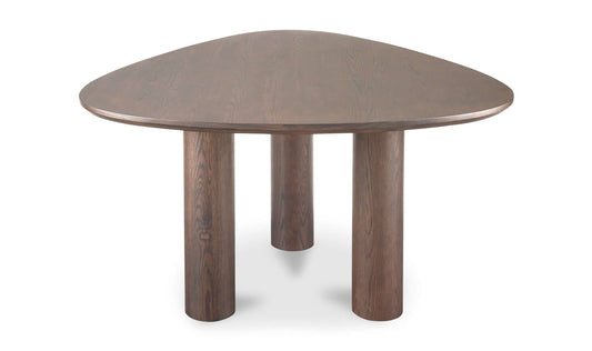 Full view of a brown contemporary dining table with a rounded triangle top and three-column base.