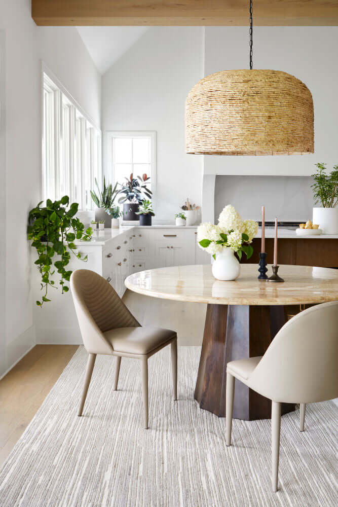 Linus dark brown dining table by Surya set in a modern dining room with natural light and decor.