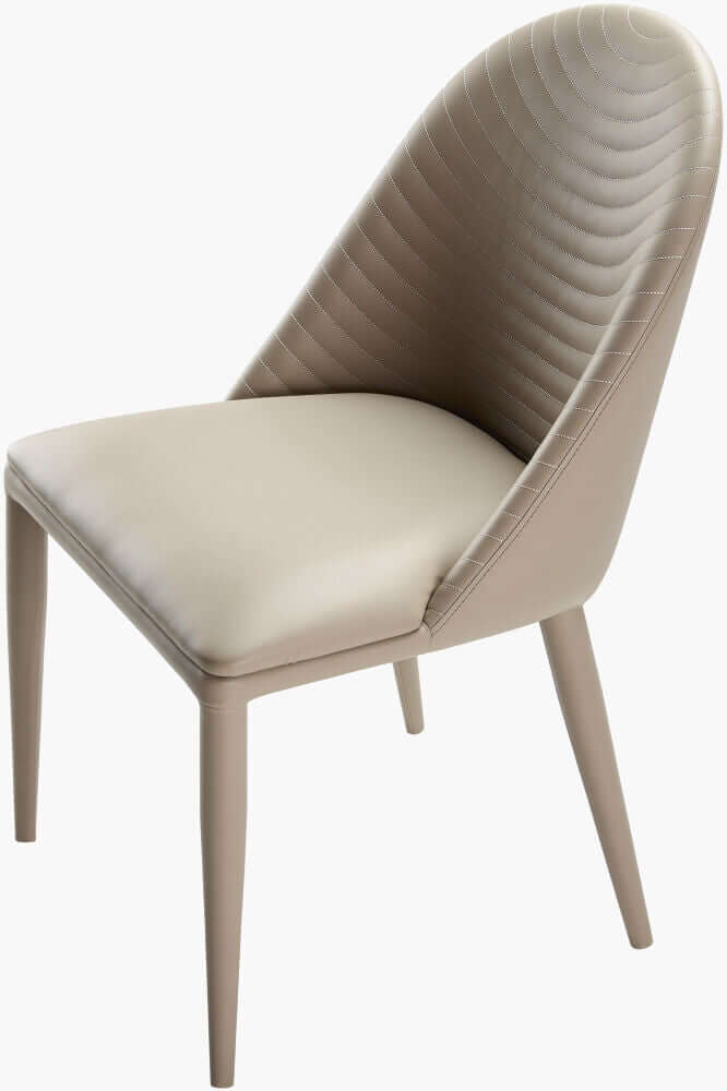 Angled view of the Lacey beige leather dining chair by Surya highlighting the faux leather upholstery.