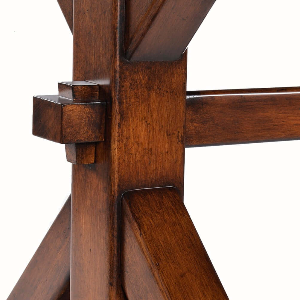 Close-up of the "K" shaped base of the Madison Dining Table, highlighting the solid Acacia wood construction with a rustic finish.