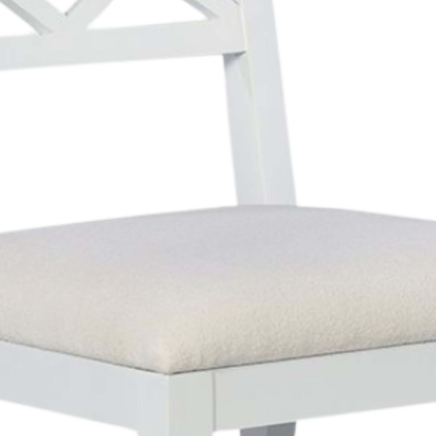 Detailed view of the drop-on upholstered seat of a white wood dining chair, showcasing its plush fabric and sturdy construction.