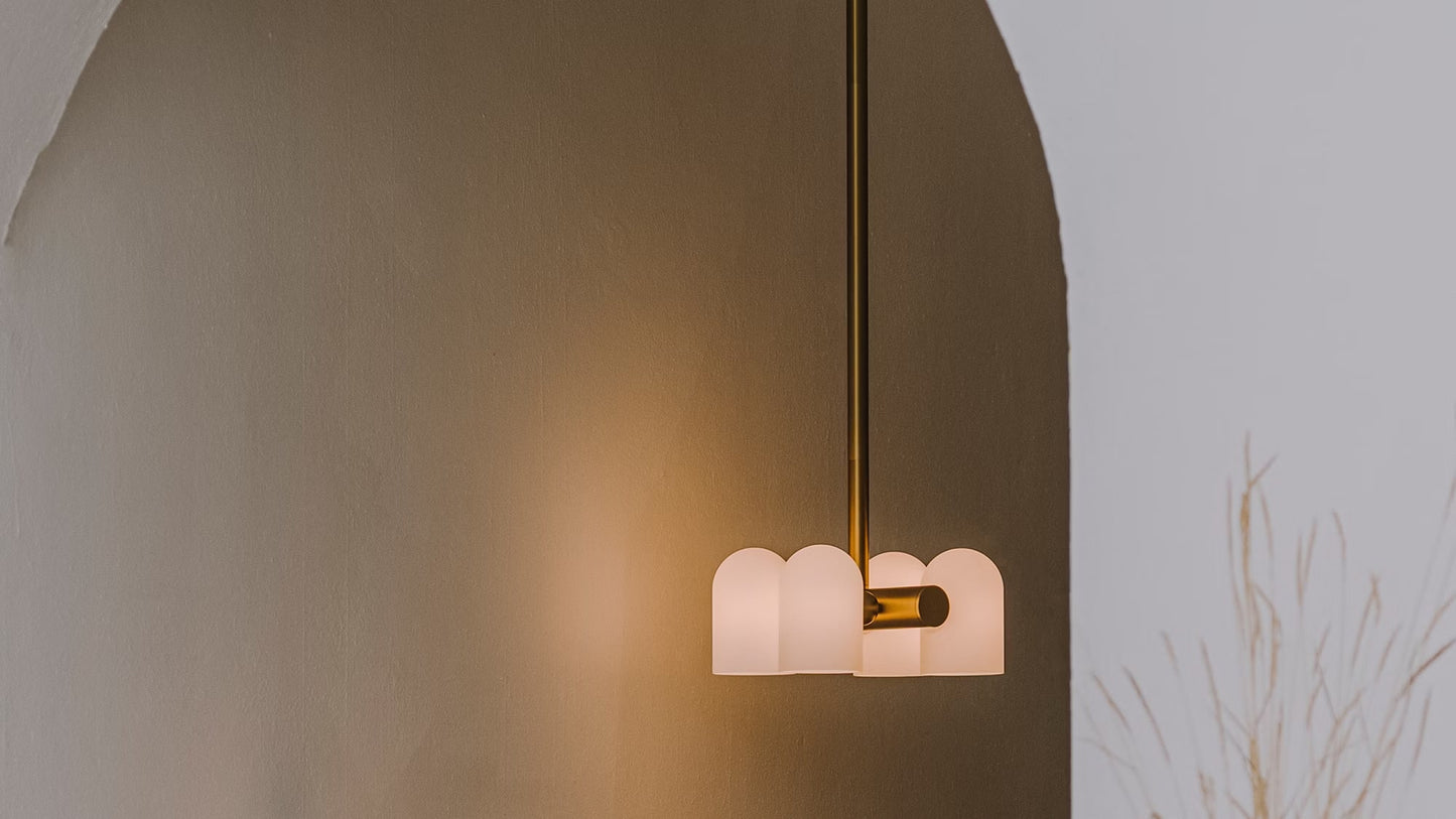 Odyssey 6 Pendant Light in a contemporary interior setting with burnished brass finish.