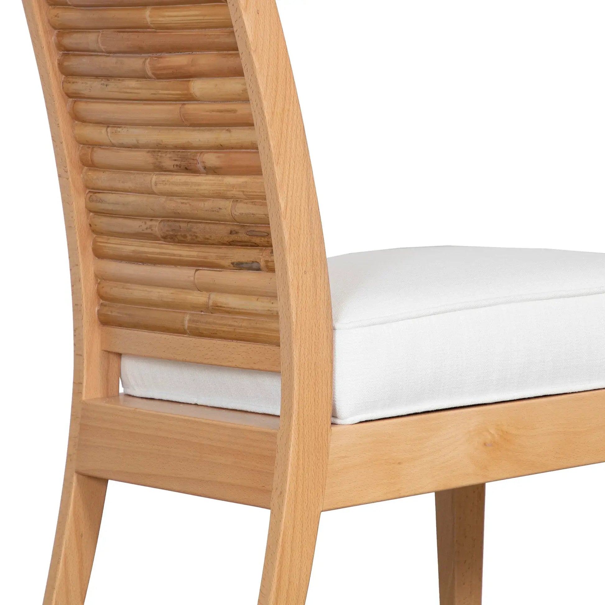 Close-up of the Stacked Bamboo Dining Chair in natural finish, focusing on the bamboo back panel and white cushioned seat.