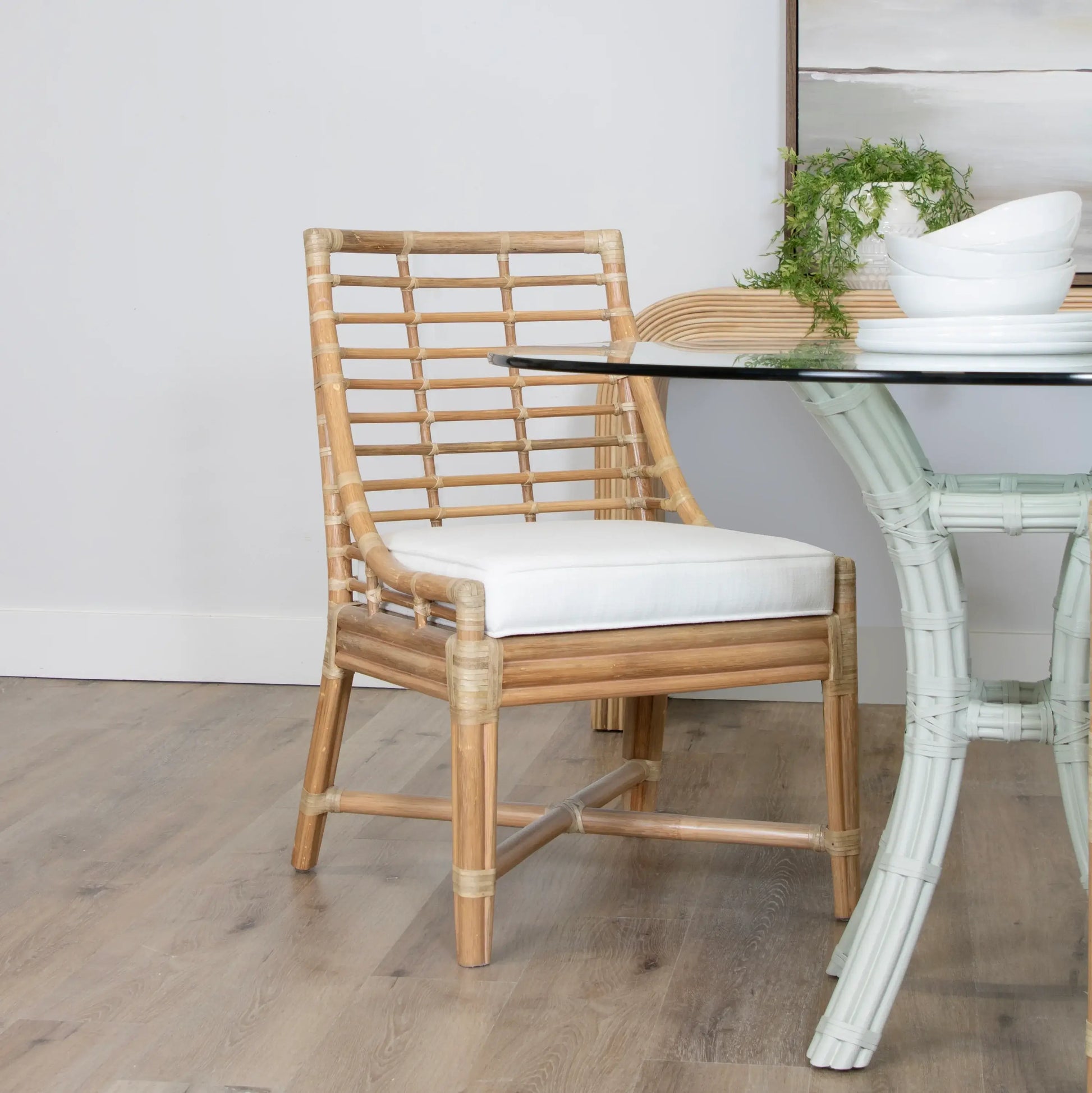Luna Dining Chair by David Francis placed in a dining setting, emphasizing its elegant design and natural finish.