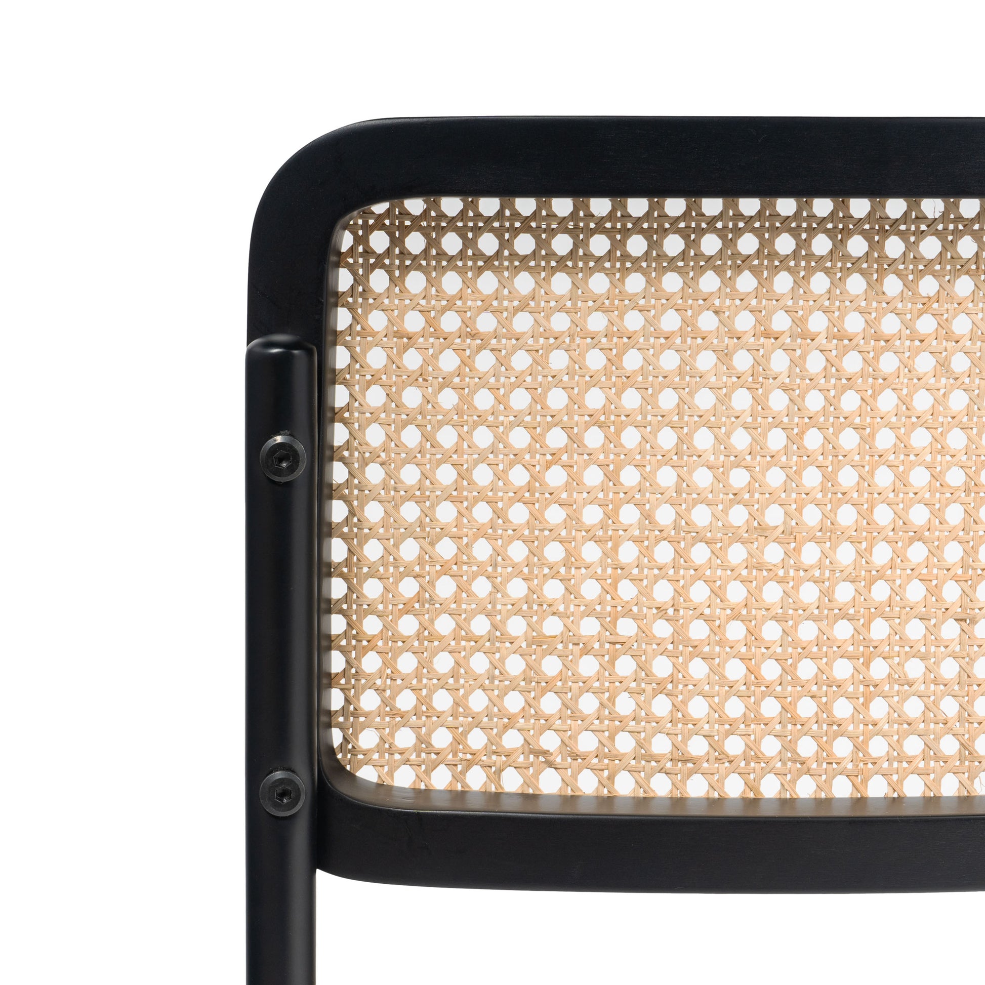 Detailed side view of black frame dining chair with cane weave backrest and seat, emphasizing craftsmanship and structure.