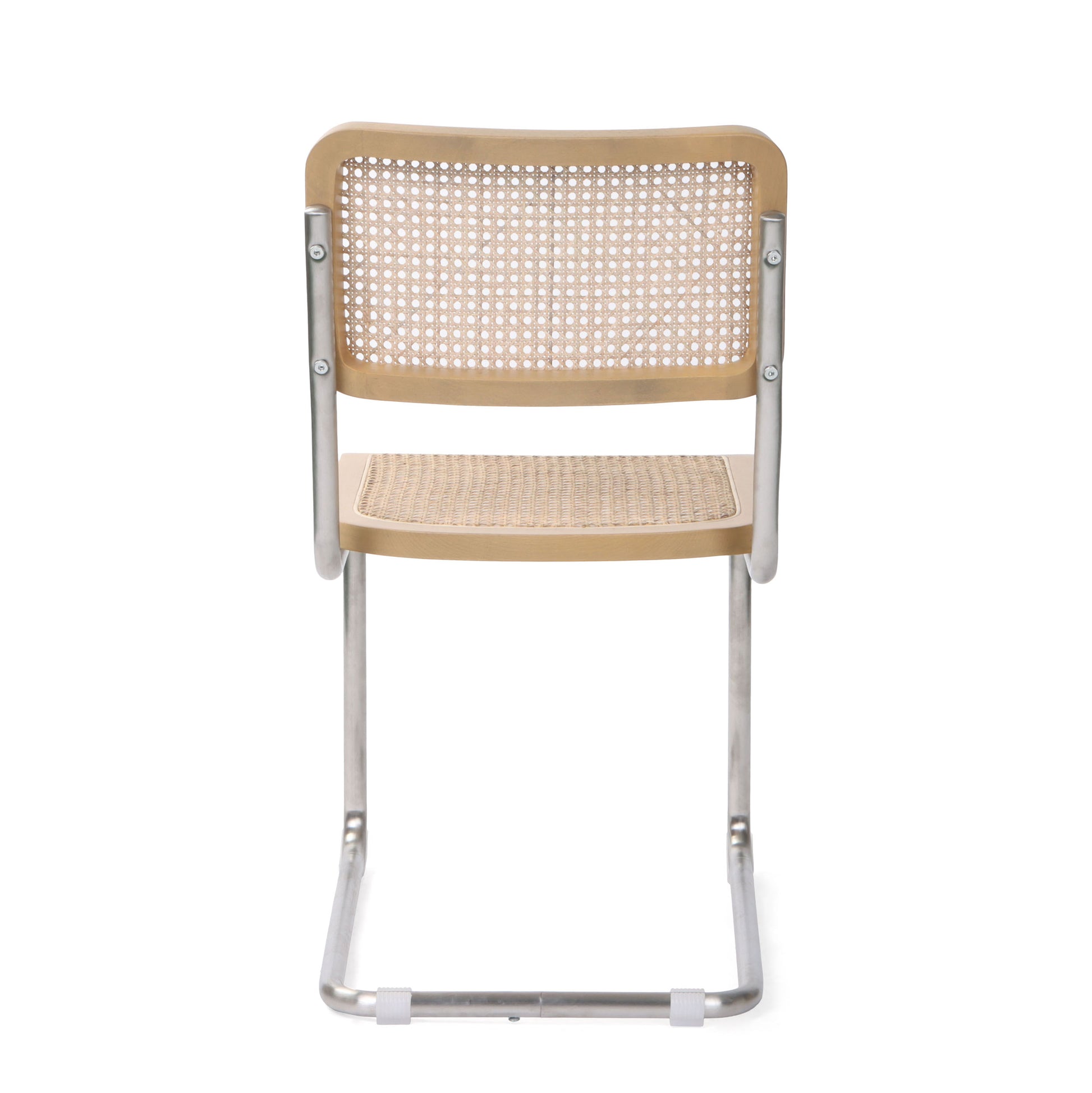 Straight rear view of a silver cane dining chair with a curved steel frame and cane backrest.