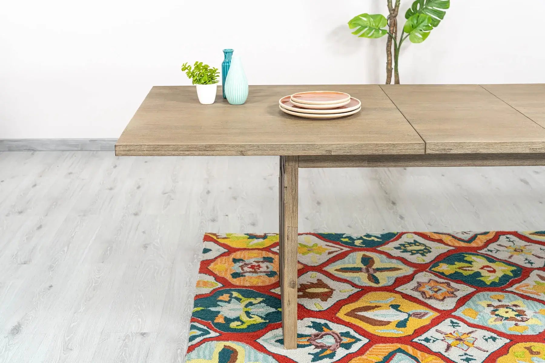 Profile shot of the Atlantis extension dining room table leg structure and extension leaves.