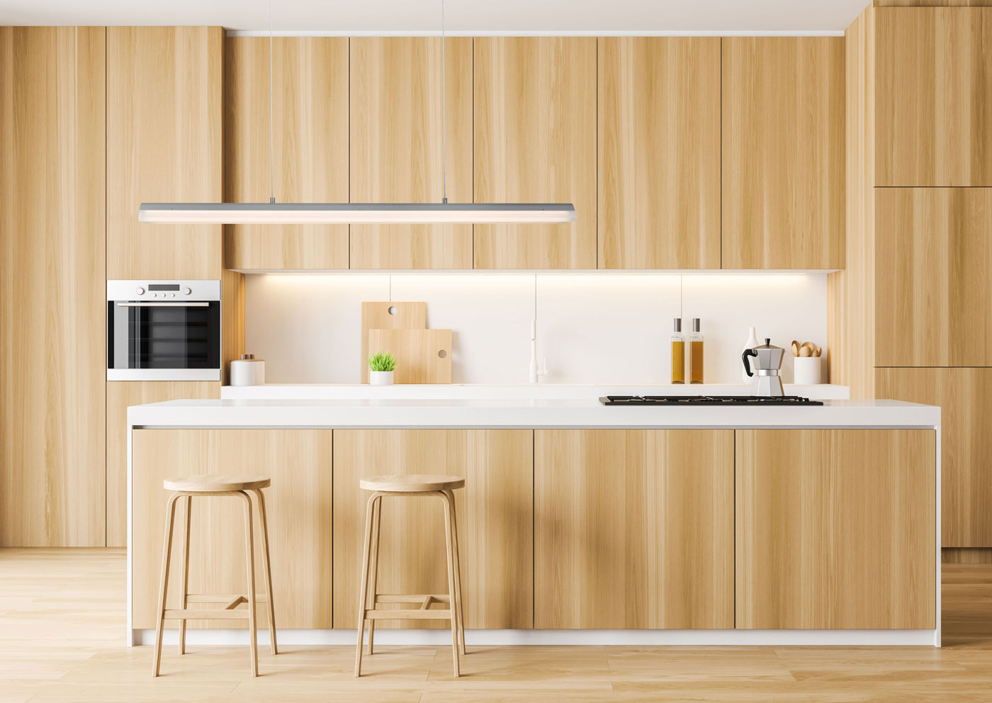 Brushed aluminum bar pendant light over modern kitchen island.