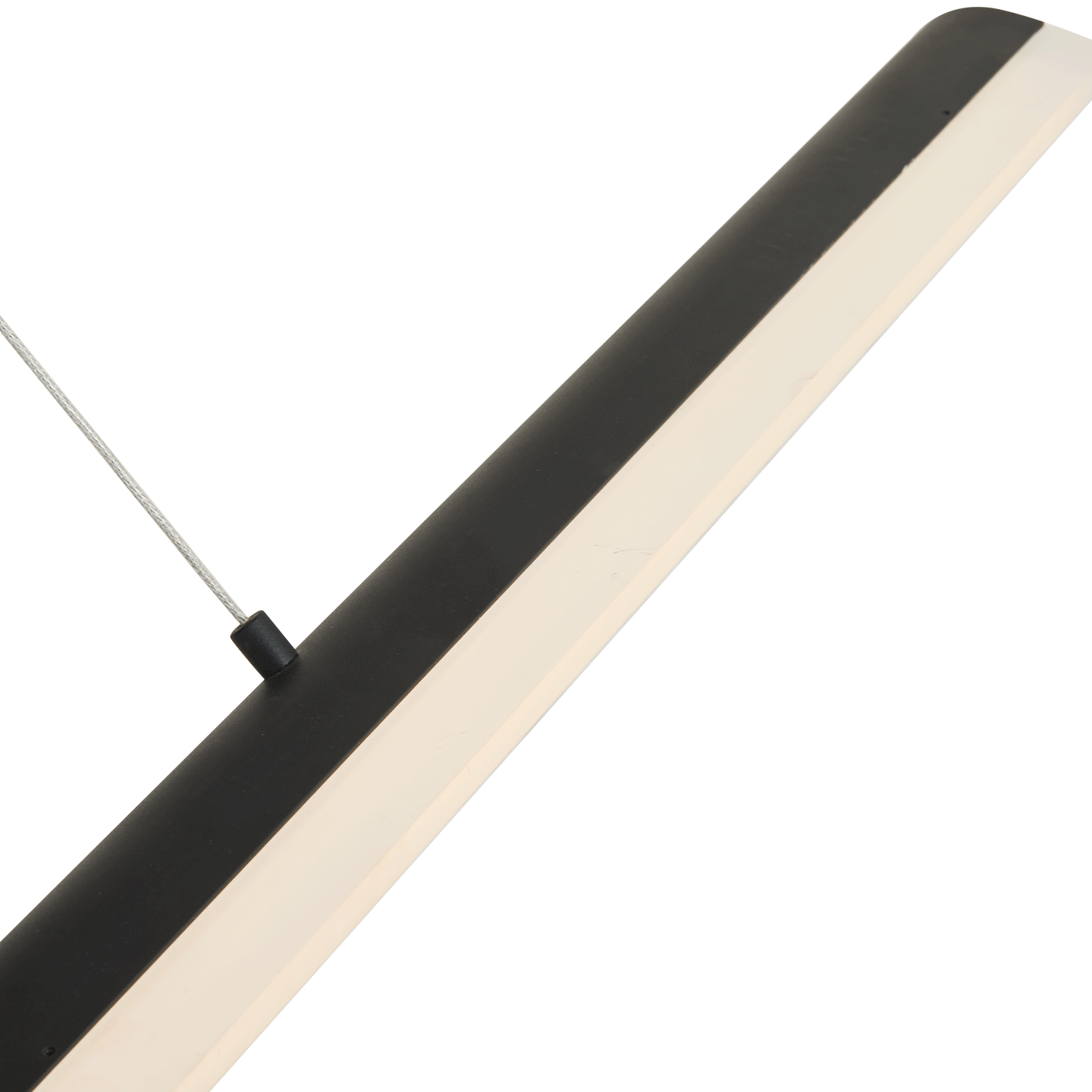 Hero shot of matte black bar pendant light glowing warmly.