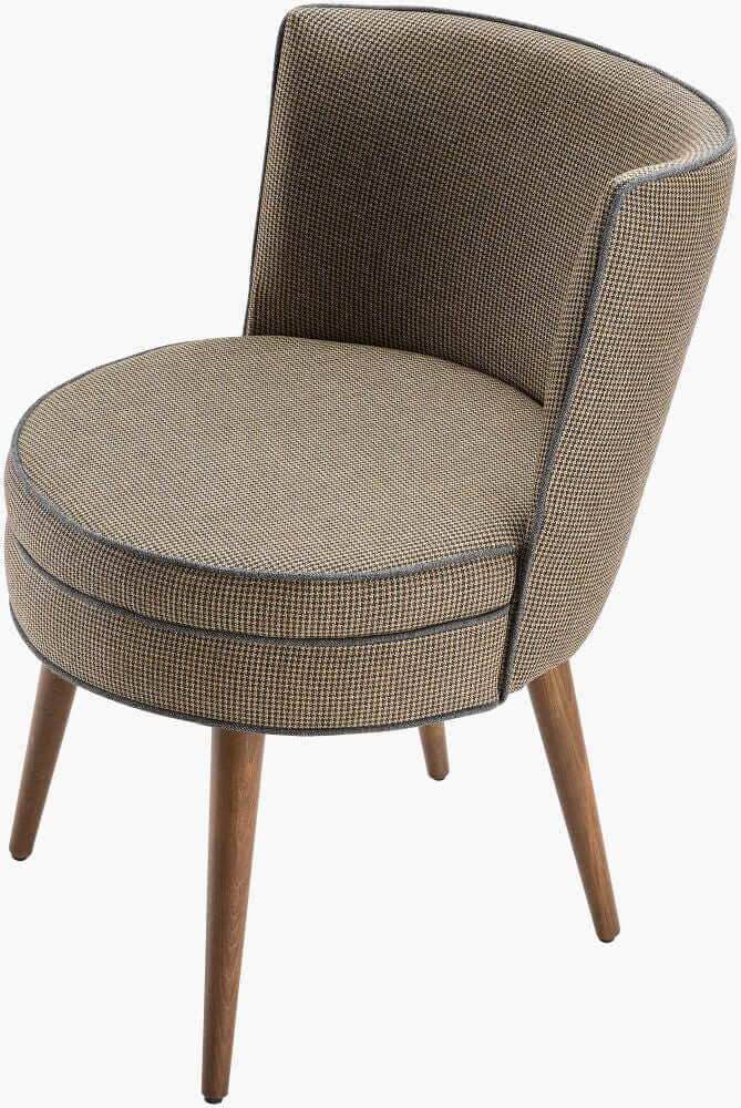 Angled view of the Surya Gabby dining chair highlighting its soft curves and durable beechwood legs.