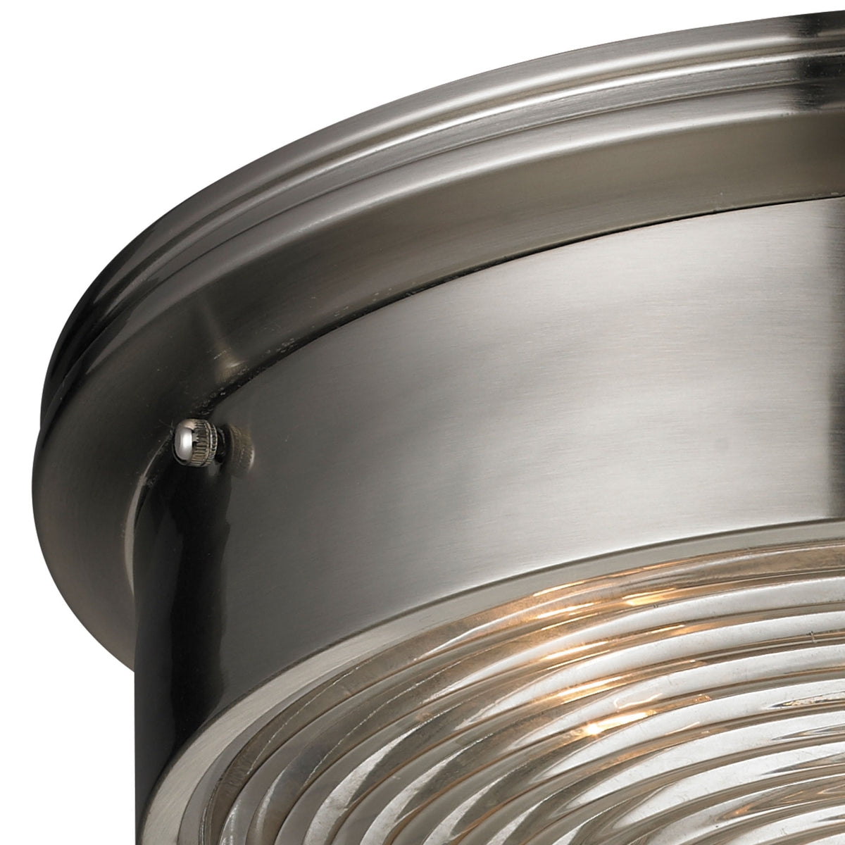 Close-up view of the brushed nickel frame and ribbed glass diffuser on the Chadwick 15-inch flush mount ceiling light.