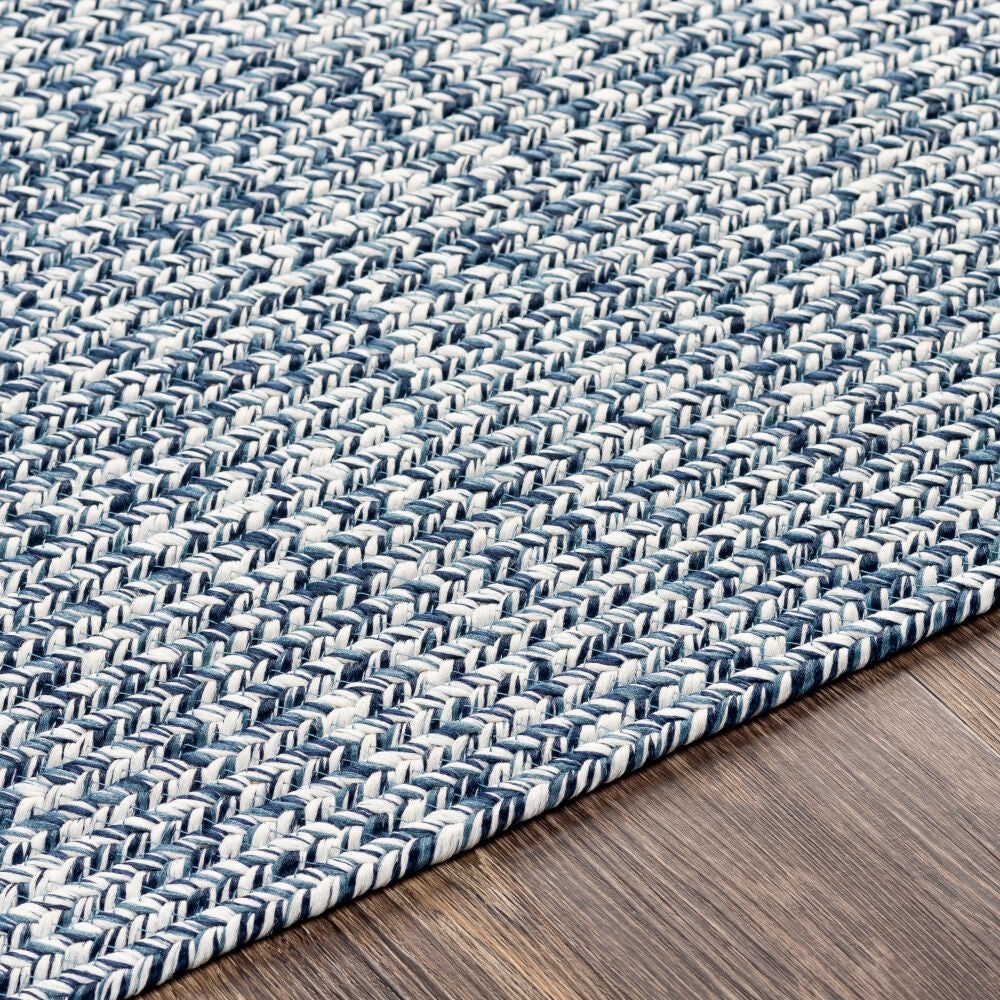 Close-up of intricate denim-inspired woven texture on polypropylene rug.