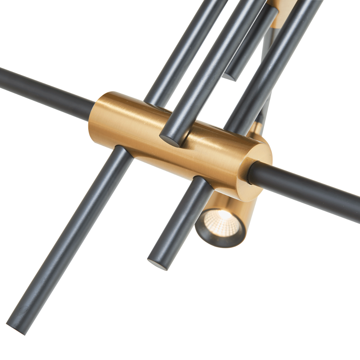 Close-up of Spartan cylinder pendant light connector in black and gold.