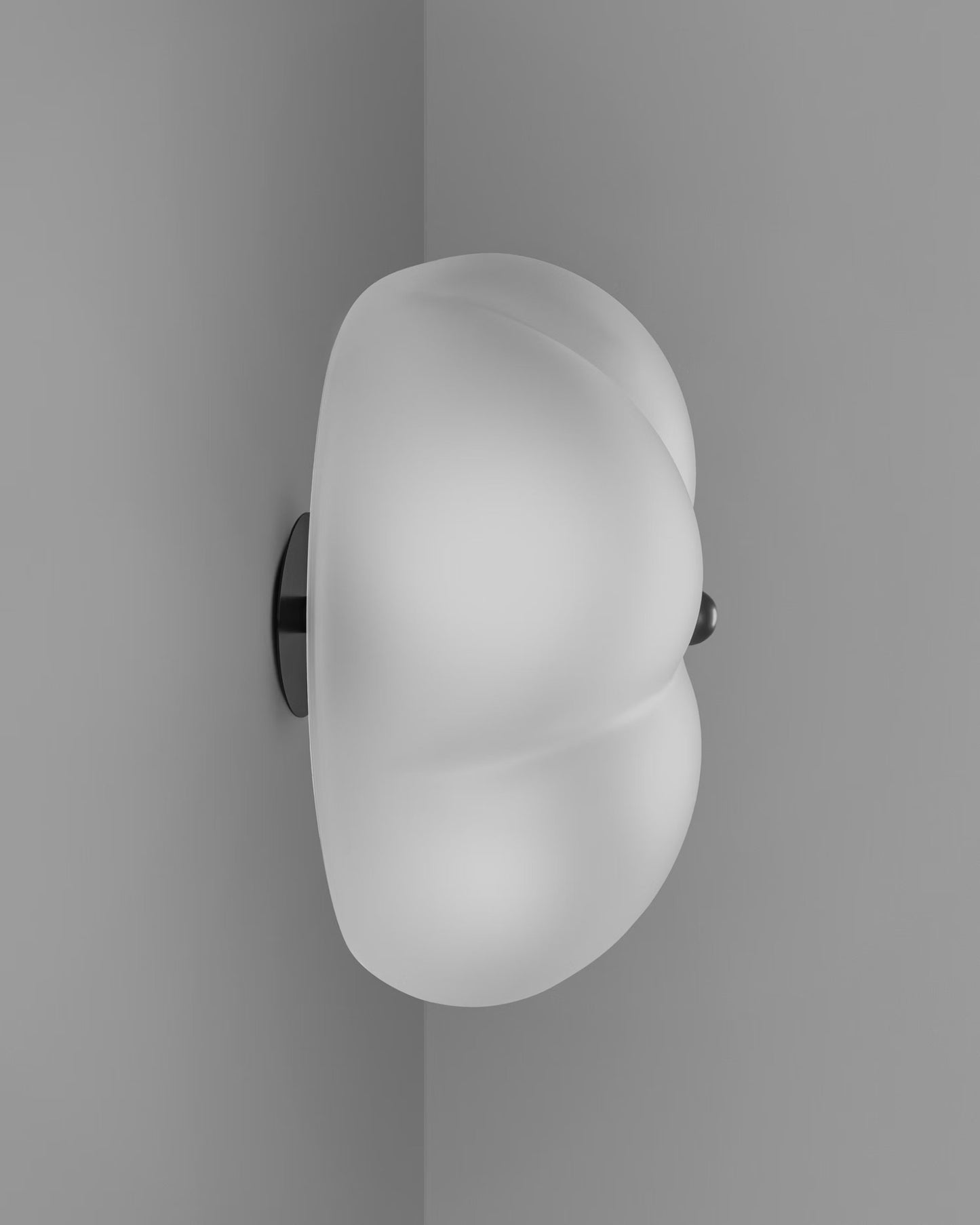 Wall-mounted Hana Flush Mount with frosted glass shade and black gunmetal hardware.
