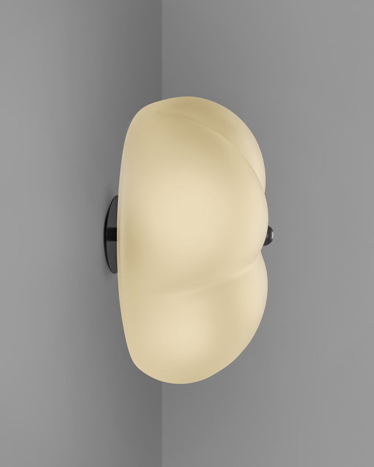 Wall-mounted Hana Flush Mount illuminated, highlighting the glow of its frosted glass shade.