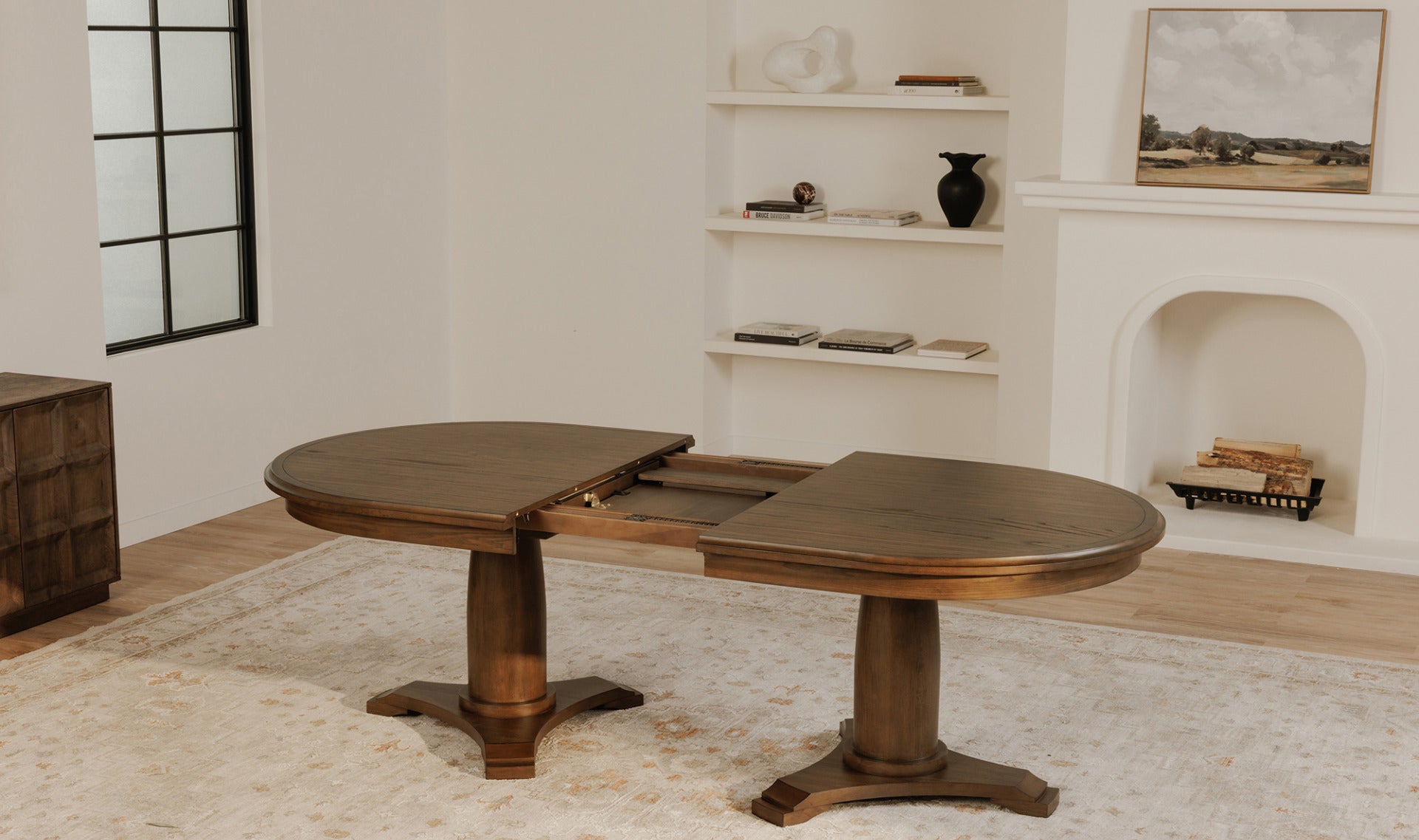 The Jamie brown extension dining table in a rustic dining room setting, with the table partially extended.