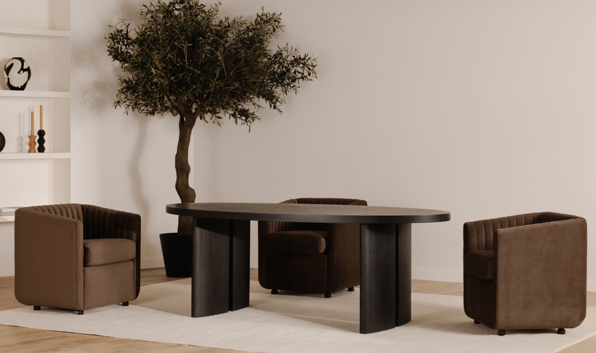 The Jane brown velvet dining chair styled in a modern dining room, adding contemporary elegance.