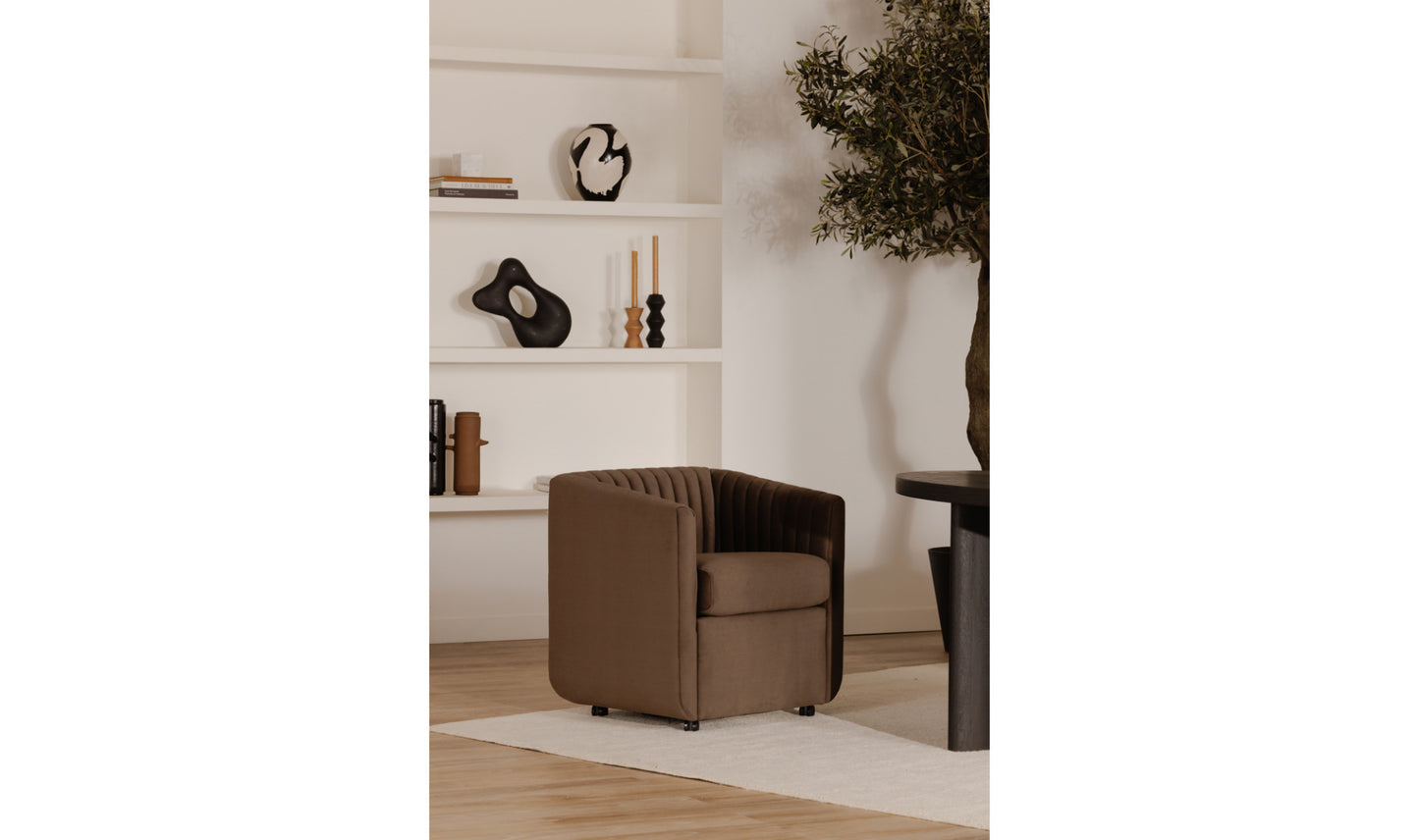 Jane velvet brown dining chair styled in a modern dining room setting.