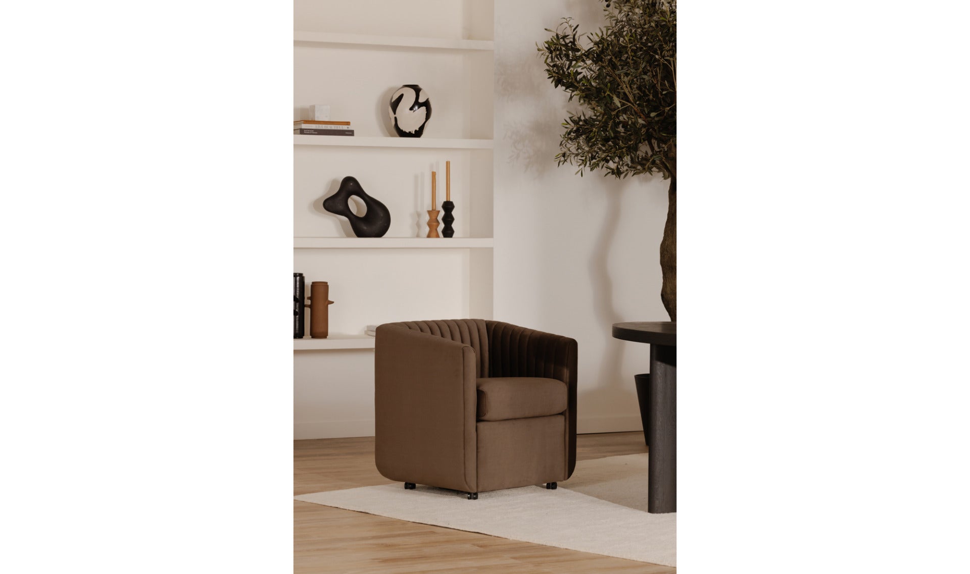 Jane velvet brown dining chair styled in a modern dining room setting.