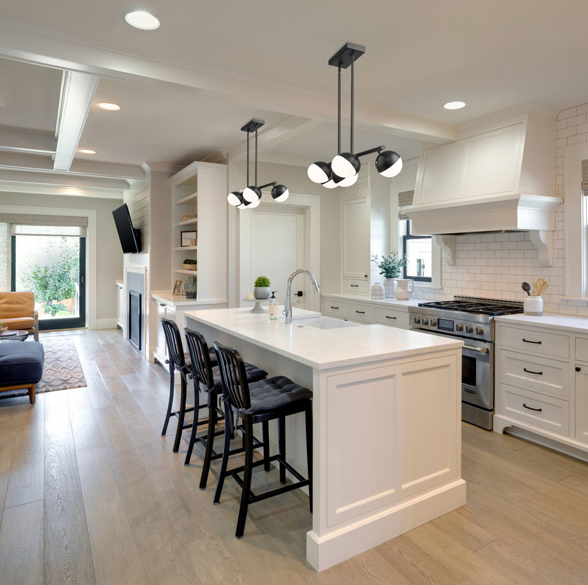 matte black linear chandelier above kitchen island.