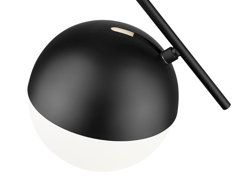 Close-up of mid-century modern one-light pendant matte black opal globe.