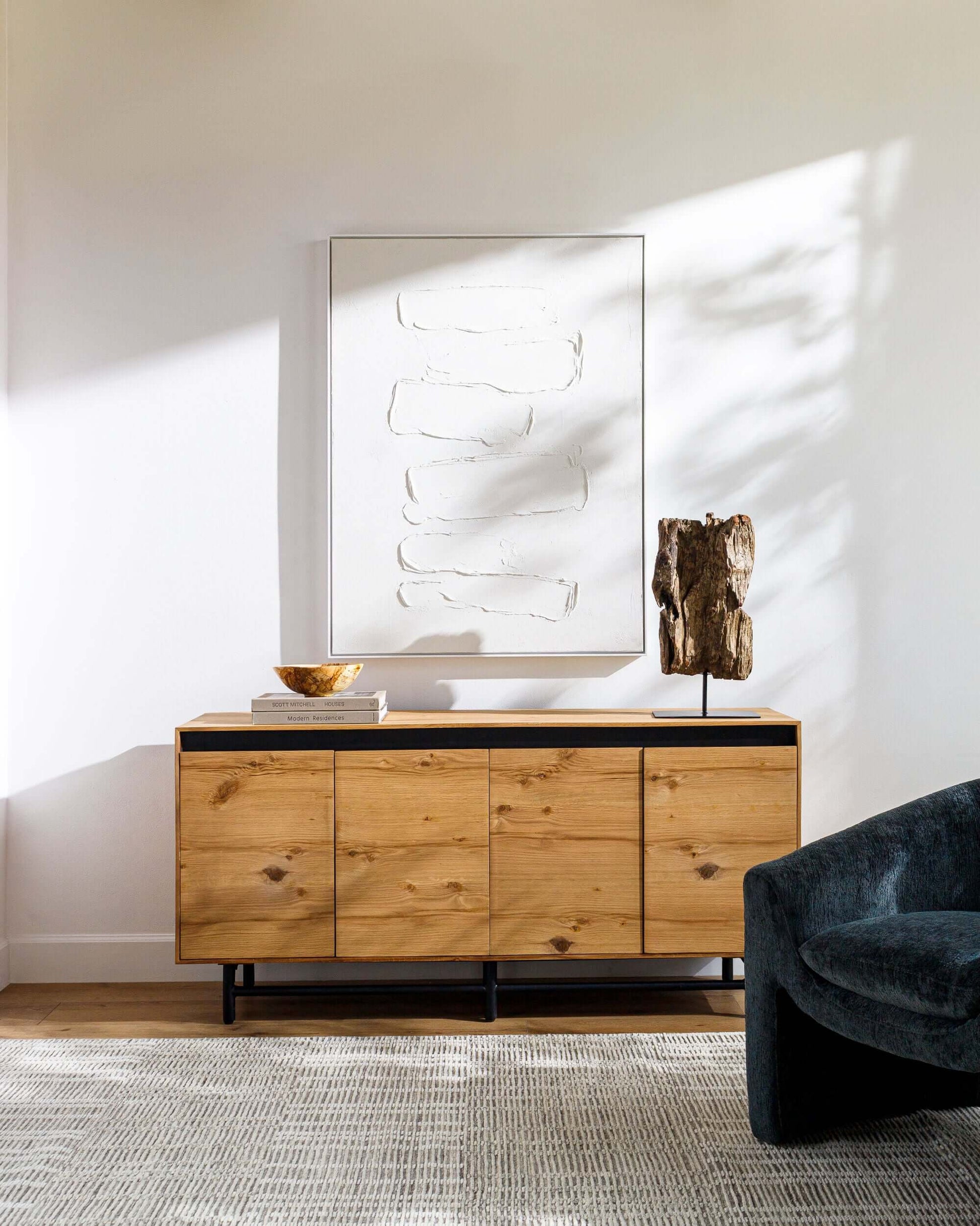 Molander Dining Sideboard styled in a contemporary living room, enhancing the space with modern aesthetics.