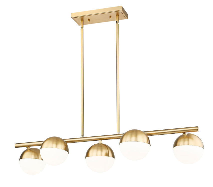 angled view of modern gold five-light island chandelier with opal glass orbs.