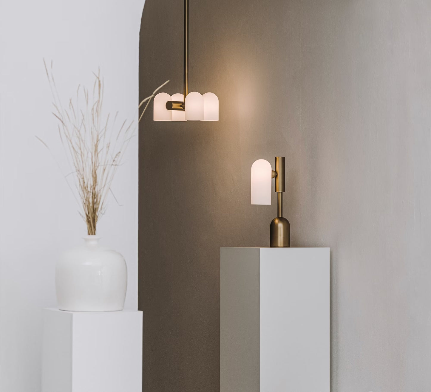 Minimalist arrangement of Odyssey Pendant and matching table lamp in modern décor.