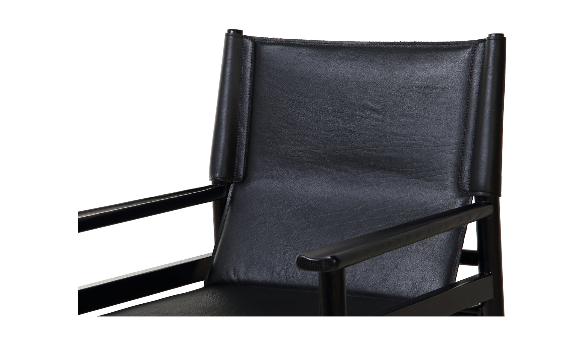 Detailed close-up of the top-grain buffalo leather seat and backrest of the Remy Black Mid-Century Modern Dining Chair.