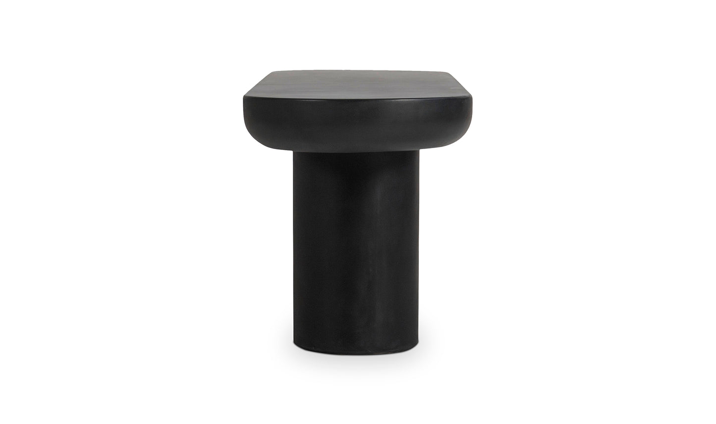 Detail shot of the Rocca black concrete dining bench iron frame legs