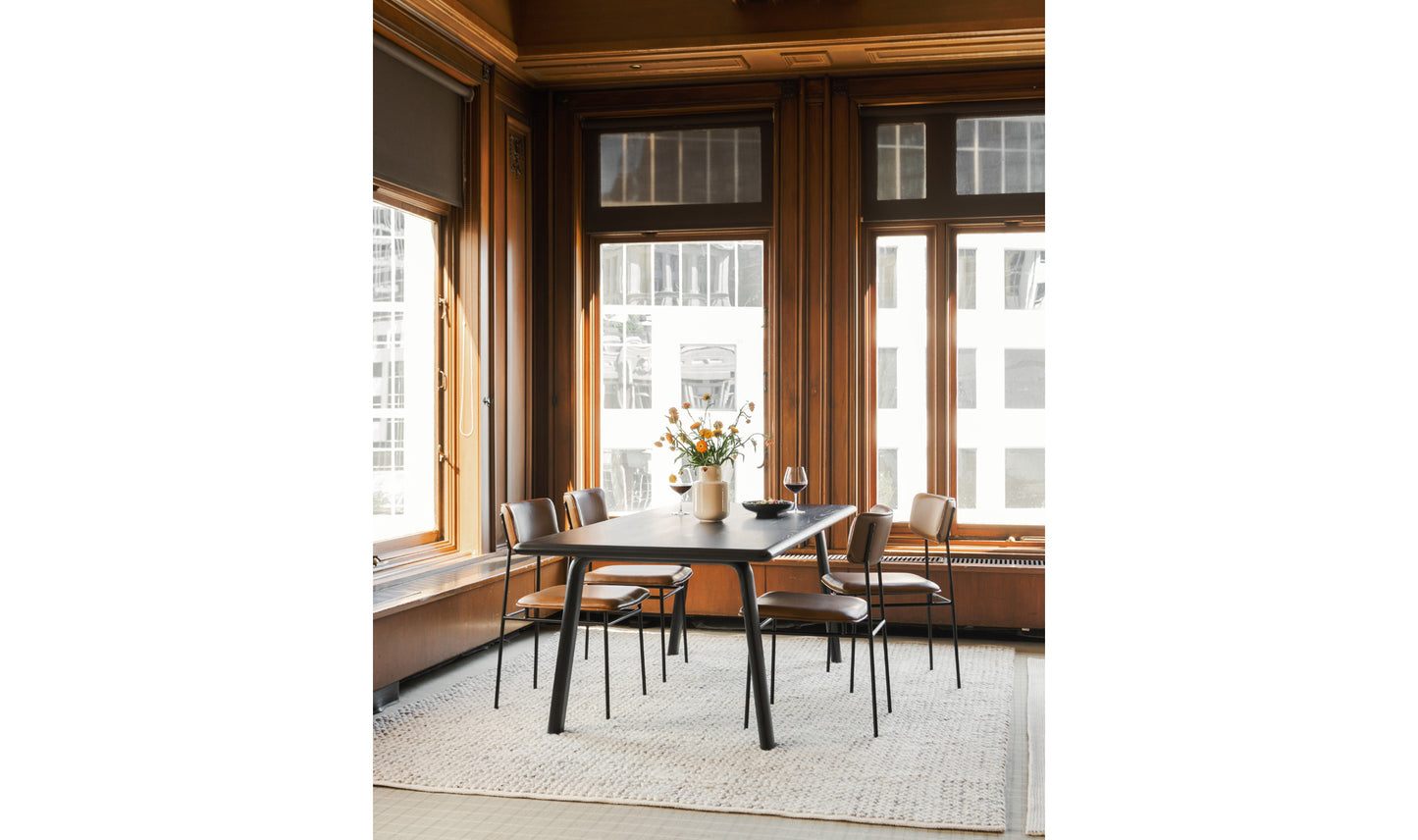 Sailor brown modern dining chairs in a dining room setup.