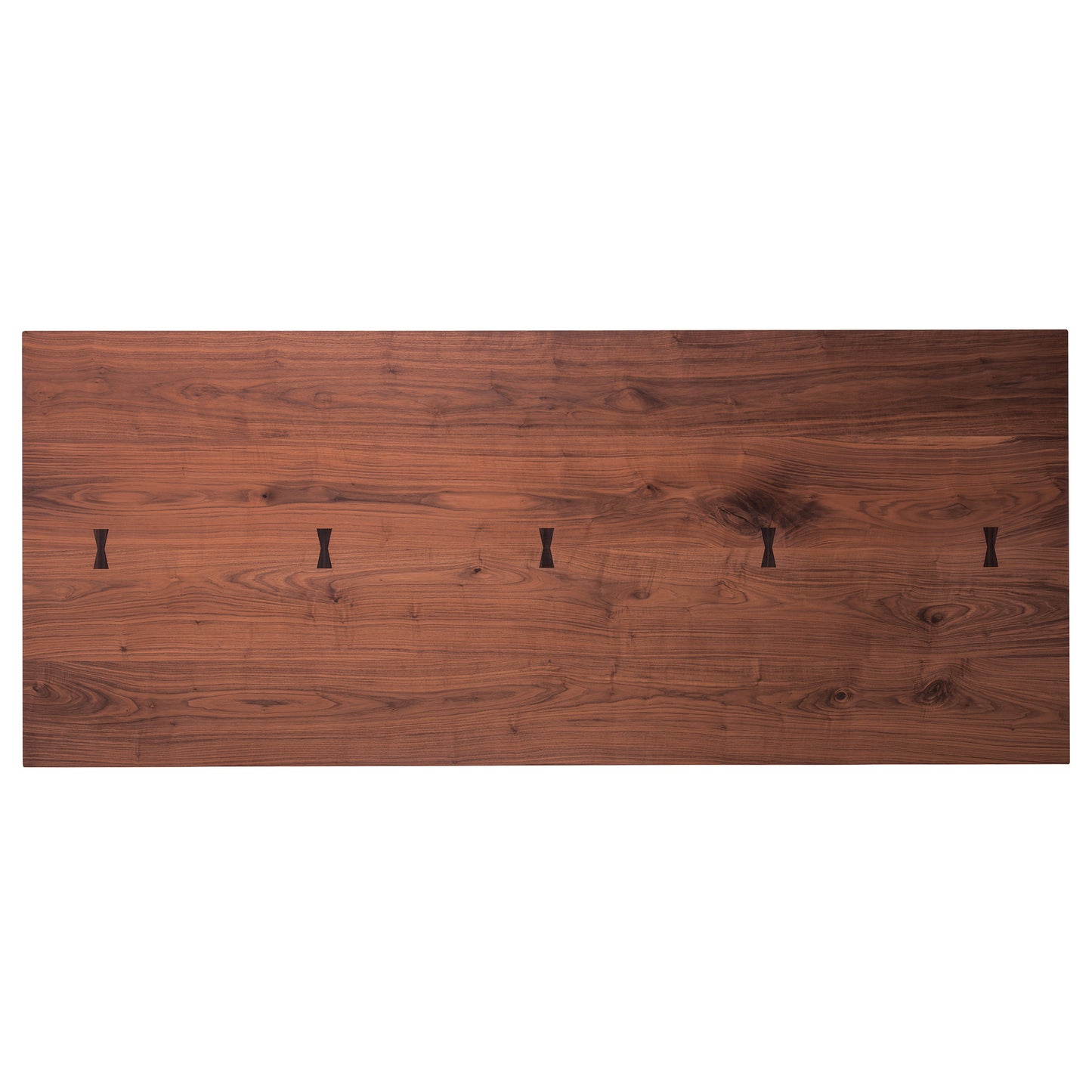 Top-down view of the Hakama Dining Table featuring butterfly inlays and walnut grain.