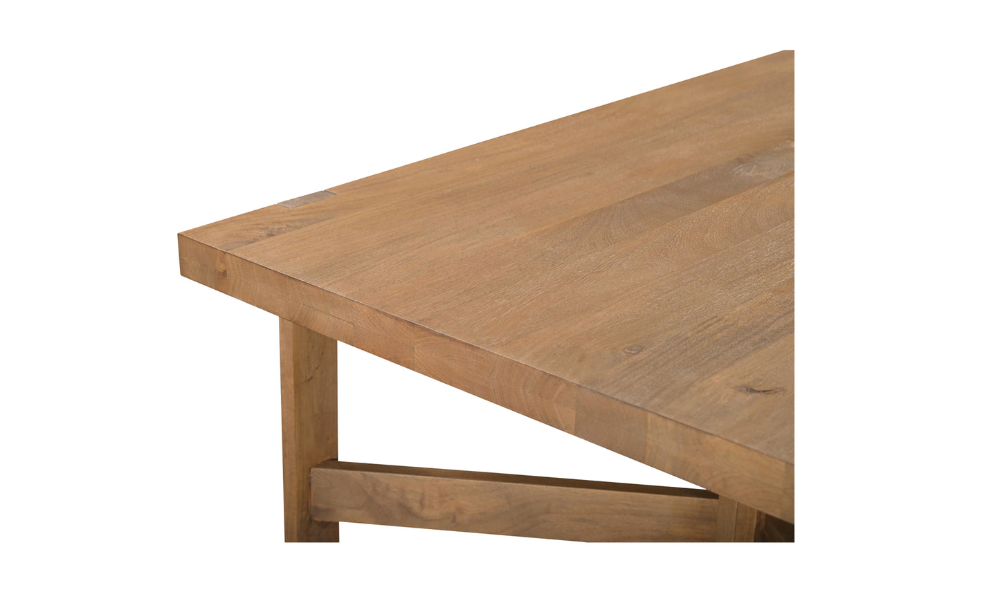 Close-up view of the workshop modern wooden dining table's corner, highlighting the craftsmanship and sandblasted finish.