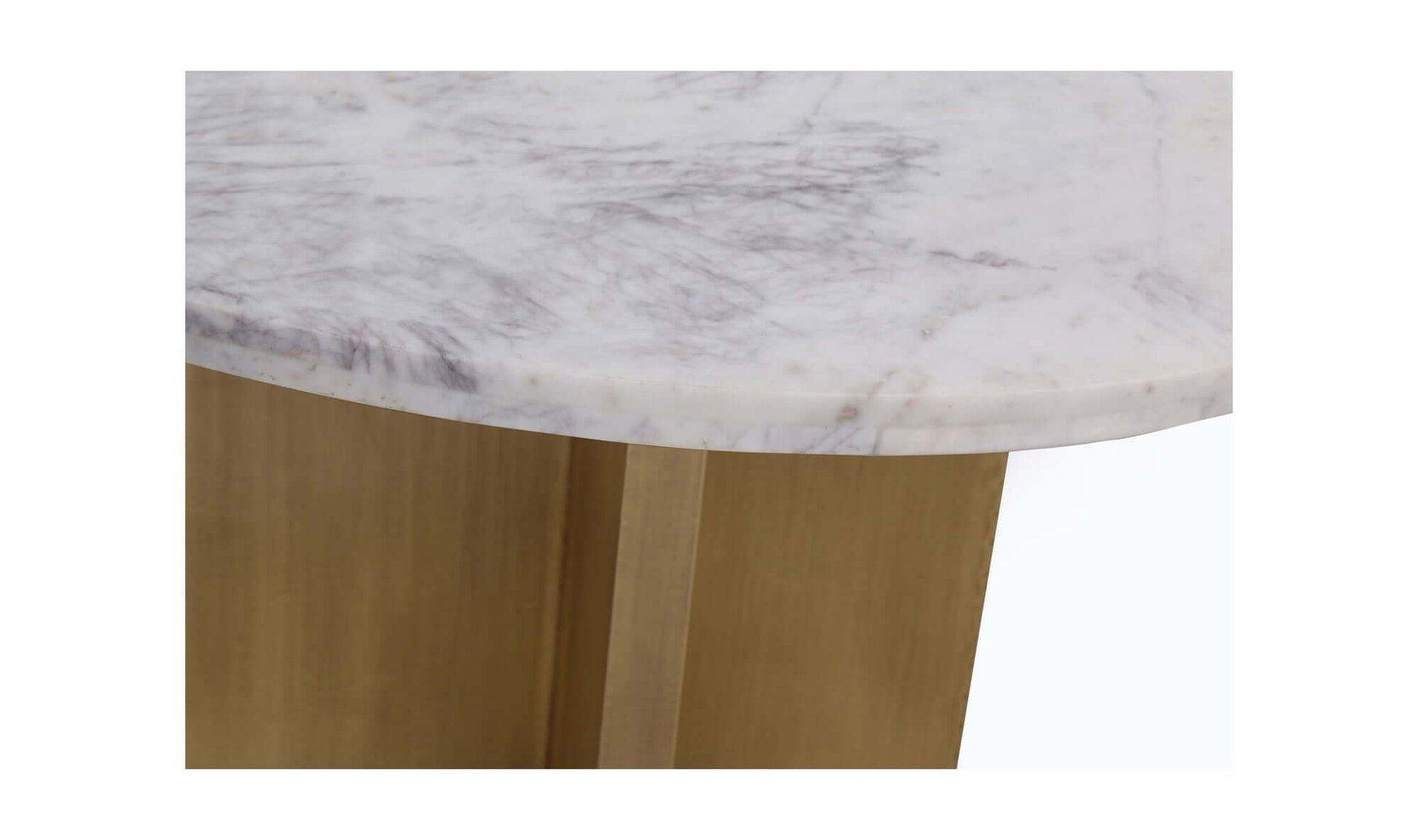 Close-up of the white marble tabletop with natural veining, part of the Graze Dining Table.