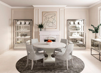 Lifestyle image of the Mezzanine Round Dining Table in a dining room setting with seating for six, showcasing its versatility and style.