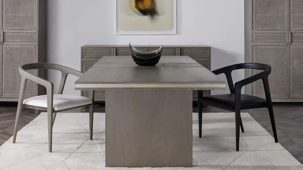 Room view of the Hampstead Dining Arm Chair by Case & Canvas, placed stylishly at a dining table.