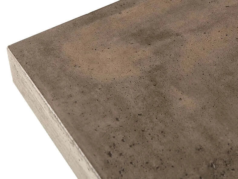 Close-up of the Conrad Dining Table's natural concrete finished top by Case & Canvas, showcasing its rustic charm.