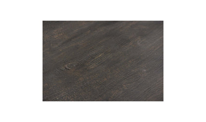  Detailed close-up of the Brolio Dining Table’s dark mango wood finish, emphasizing its rich texture.