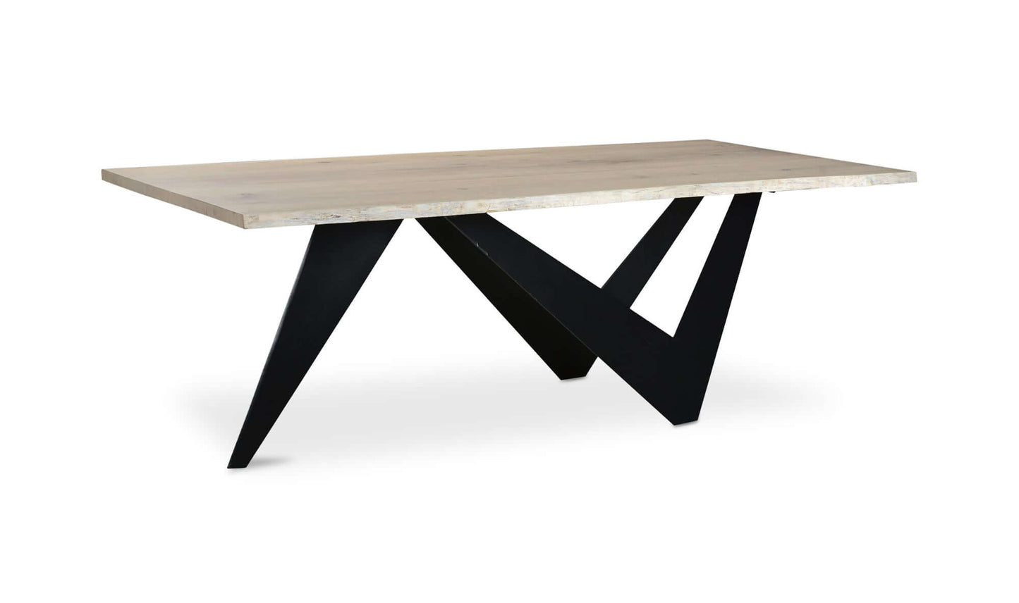 Side angle of Bird Dining Table showcasing sculpted iron base.