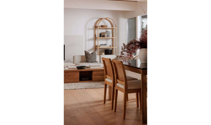 Dining area with two Orville Natural Dining Chairs and a black marble table