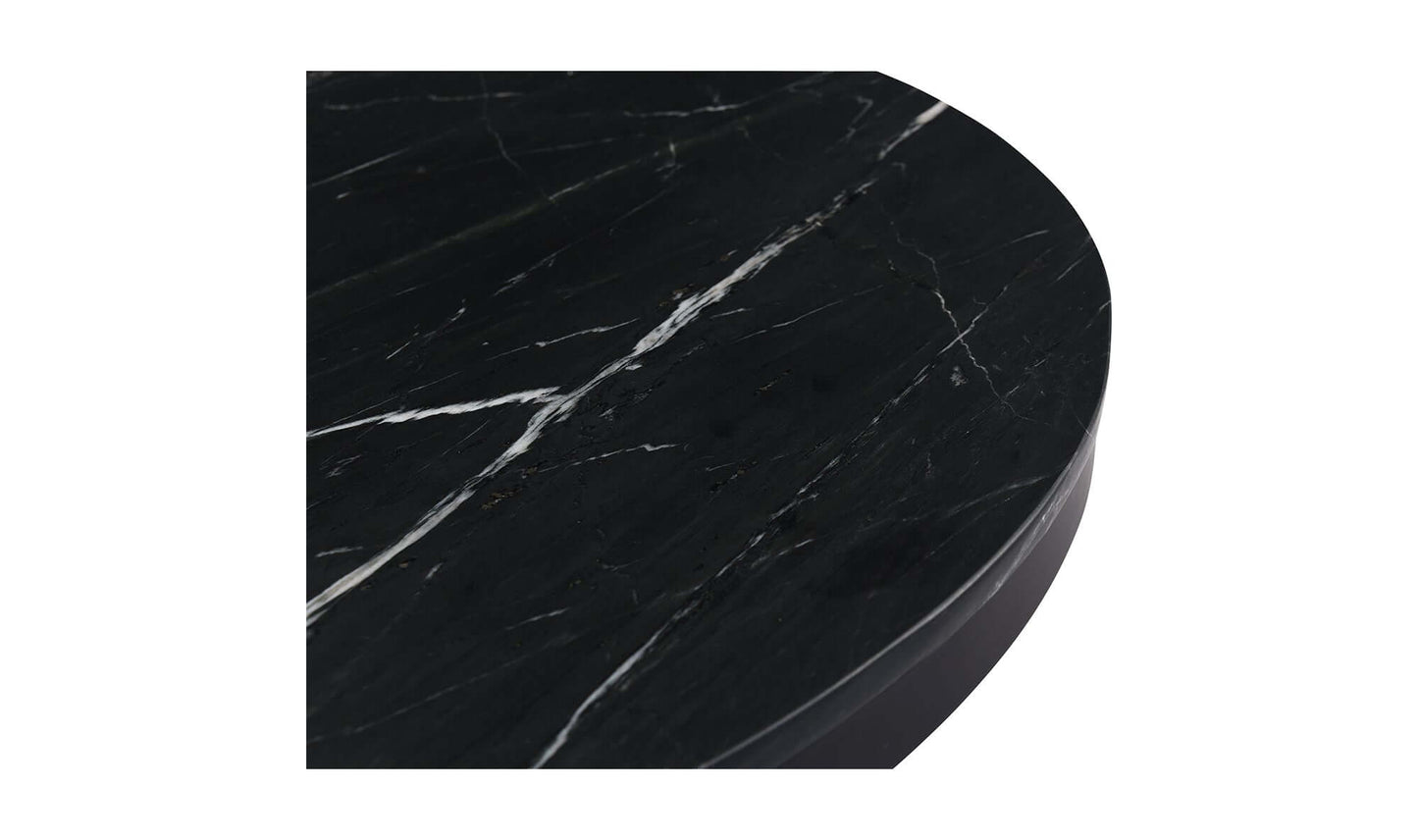 Detailed view of the Tower Black Marble Dining Table's marble top.