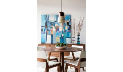 Godenza Round Brown Dining Table in a stylish dining room with blue abstract painting