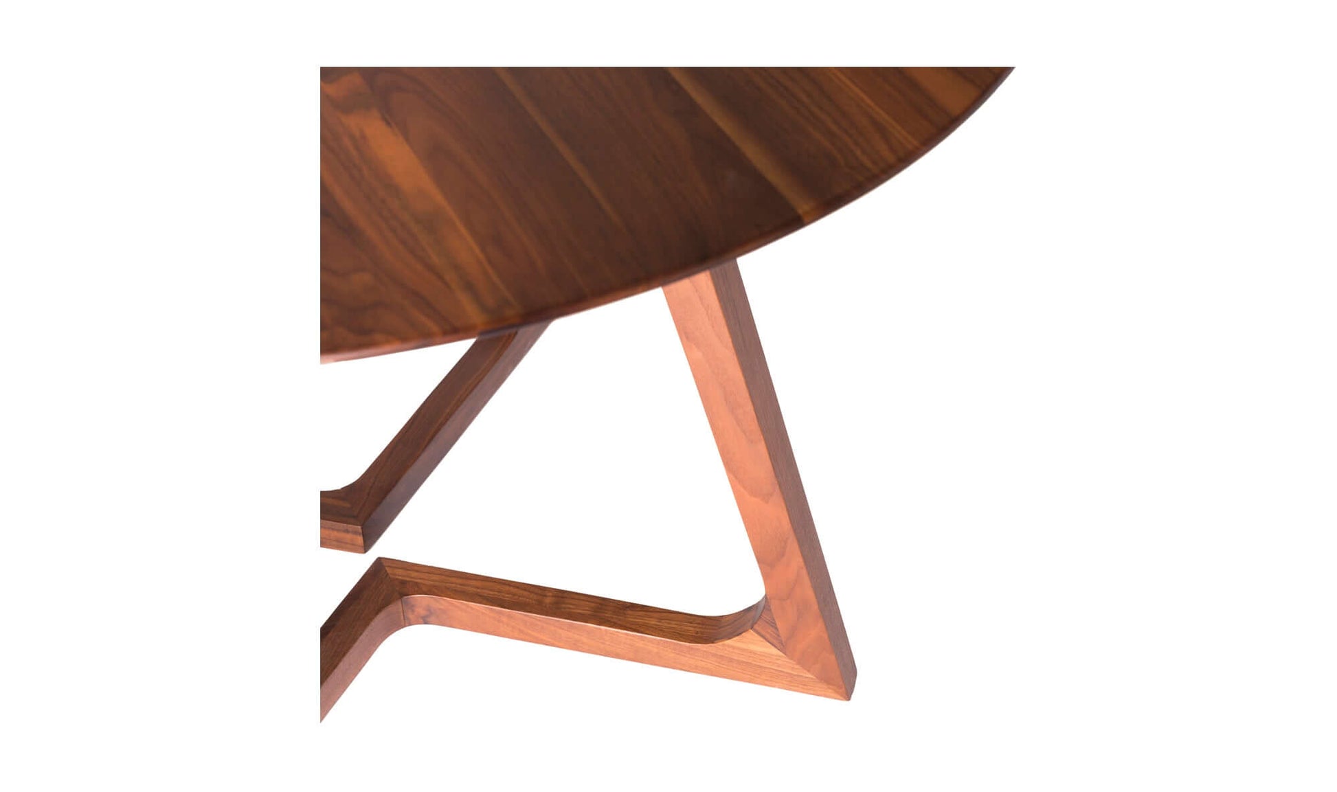 Close-up view of Godenza Round Brown Dining Table’s elegant walnut finish and sleek circular design