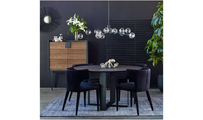 Stylish dining room with Jennaya Black Dining Chairs, modern lighting, and chic decor.