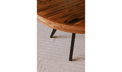 Close-up of the Parq Round Amber Dining Table showing the detailed wood finish