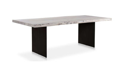 Angled view of the Moe’s Home Collection Evans Dining Table, showing the contrast between the wood top and iron legs.