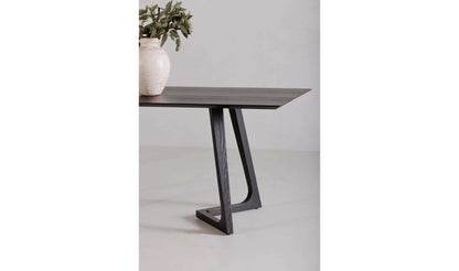 Godenza Black Rectangular Dining Table by Moe's Home Collection, showcasing solid blackened ash wood and a sculptural base.