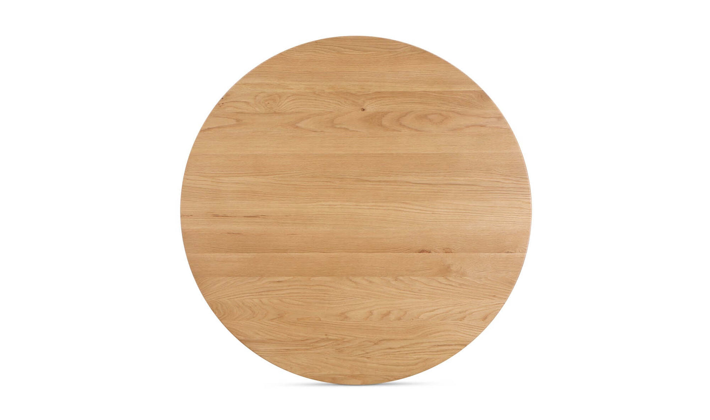 Top view of the Godenza Round Oak Dining Table, emphasizing its round shape and natural wood grains.