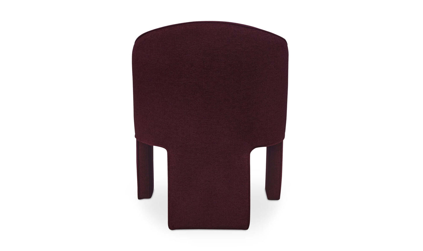 Rear view of the Clara dining chair in plum fabric, emphasizing the clean lines and modern silhouette.