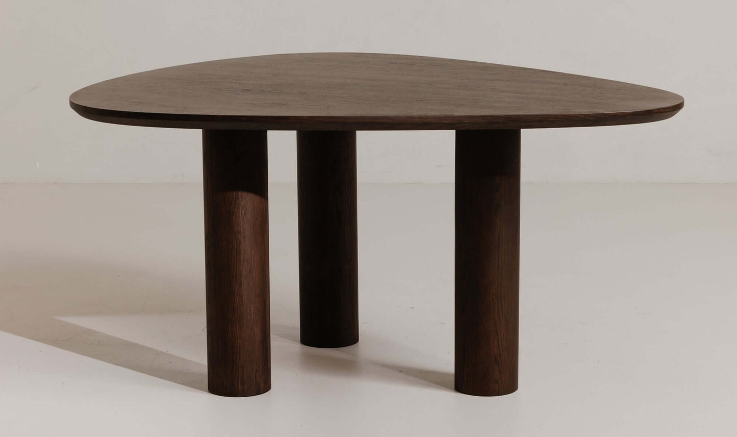 Full view of the Finley brown contemporary dining table with a unique rounded triangle design and solid base.